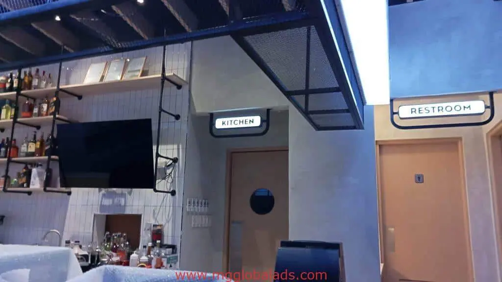 Acrylic signage for cafe kitchen and restroom doors in Makati, illuminated and installed by M&G Global Ads.