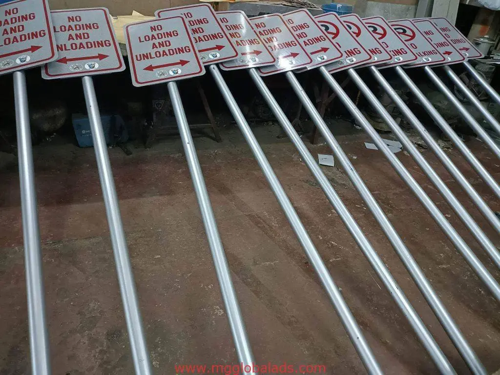 Indoor safety signage with red NO LOADING AND UNLOADING in a workshop, Makati, by M&G Global Ads.