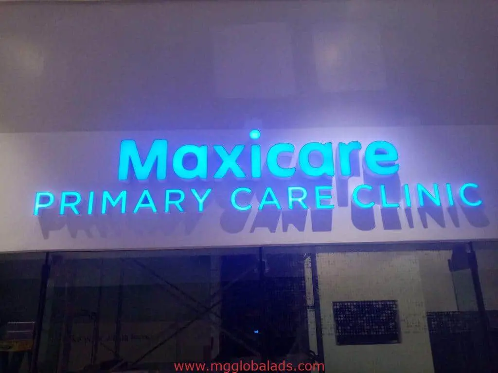 Illuminated blue LED clinic signage for Maxicare in Makati, mounted on a white wall indoors by M&G Global Ads.