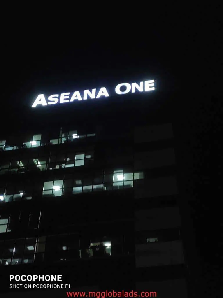 ASEANA ONE LED signage on tall office building at night in Pasig, windows lit, by M&G Global Ads.