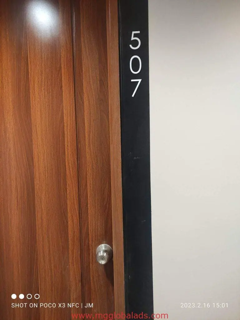Office door sign for room 507 in Makati with timestamp, black indoor signage panel by M&G Global Ads.