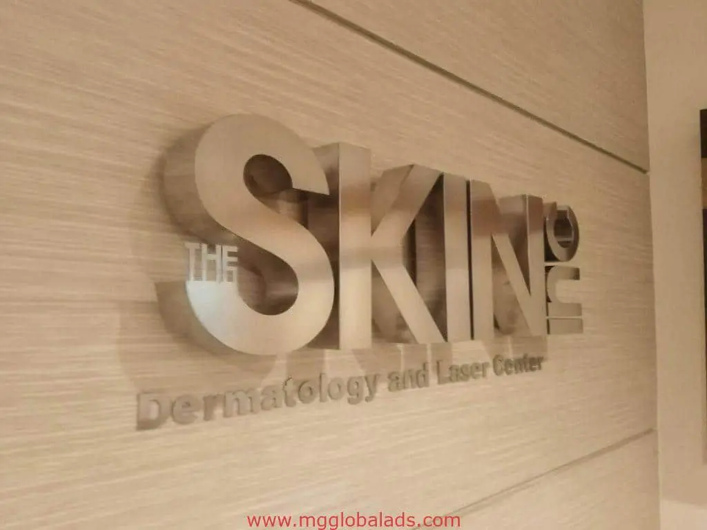 Building signage for THE SKIN Dermatology and Laser Center in large 3D metallic letters, Quezon City, by M&G Global Ads.