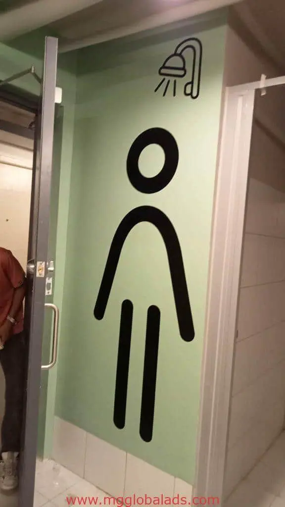 Acrylic bathroom shower signage in Mandaluyong, featuring a black stick figure with showerhead icon, by M&G Global Ads.