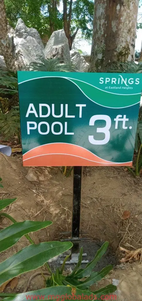 Metallic outdoor pool signage for Eastland Heights in Makati, 3 ft depth, garden setting. By M&G Global Ads.