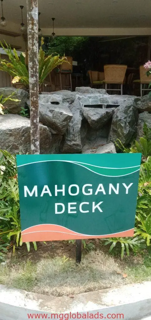 Indoor wayfinding signage for Mahogany Deck, green with white text, in Makati location, by M&G Global Ads.