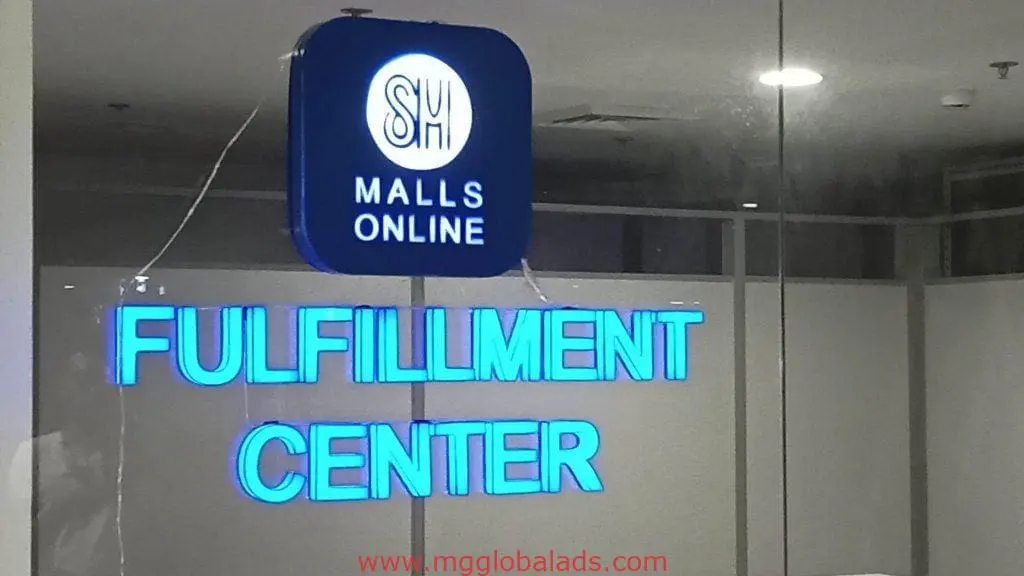 Illuminated LED signage for SM Malls Online Fulfillment Center on glass wall in Ortigas with reflections, by M&G Global Ads.