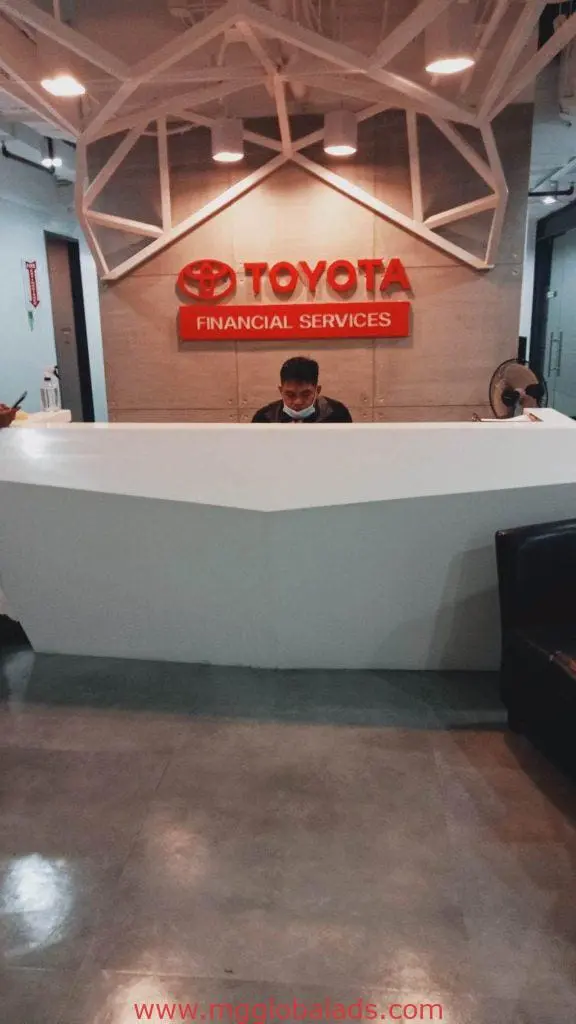 Toyota Financial Services indoor office signage, logo on wall, with reception area in Makati by M&G Global Ads.