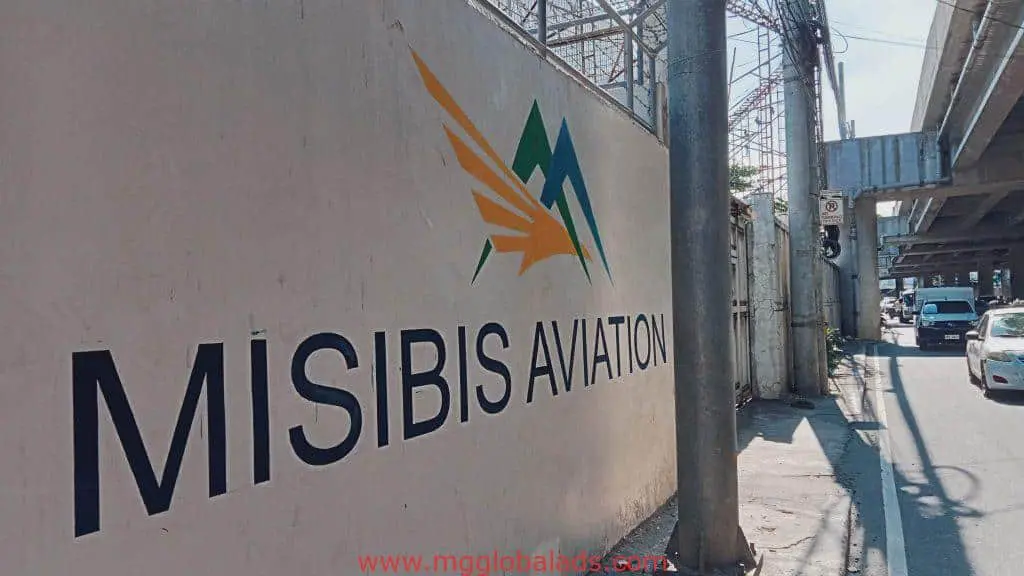 Building wall outdoor signage for MISIBIS AVIATION in Makati, with logo and text, by M&G Global Ads.