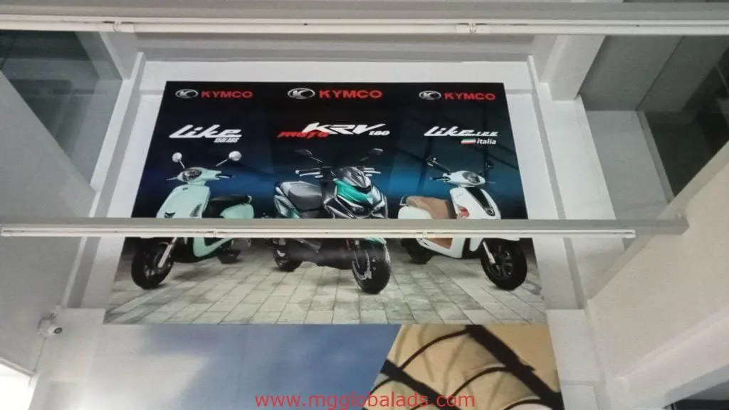 Metallic wall signage for Kymco featuring Lite Italia and KRV 180 scooters in Makati, by M&G Global Ads.