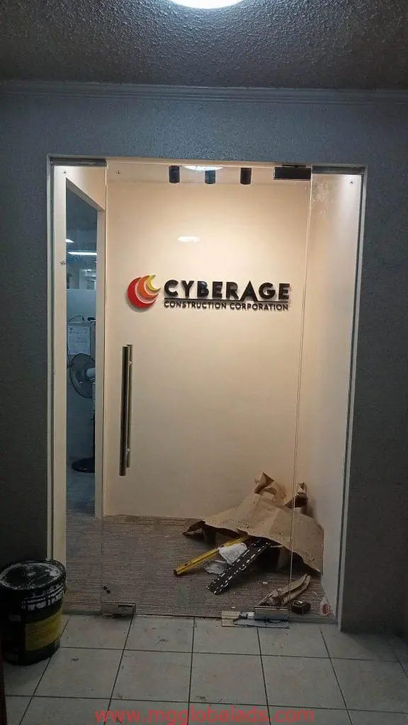 Metallic building signage for CYBERAGE CONSTRUCTION CORPORATION in Makati office under renovation by M&G Global Ads.