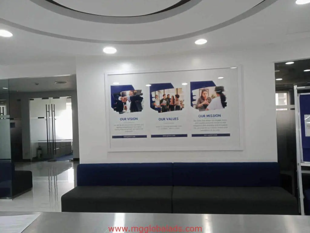 Office lobby with modern metallic vision, values, and mission signage in Ortigas, minimalist design by M&G Global Ads.