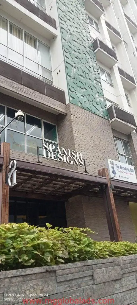 Metallic business signage for SPANISH DESIGNS with The Reading Loft in Makati, modern facade, green panel by M&G Global Ads.