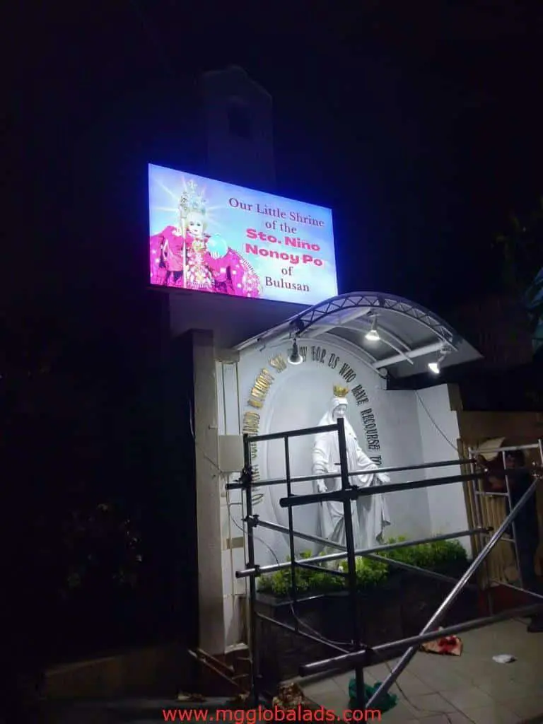 Digital billboard signage for Our Little Shrine of Sto. Niño Nonong Po, statue and scaffolding, Quezon City by M&G Global Ads.