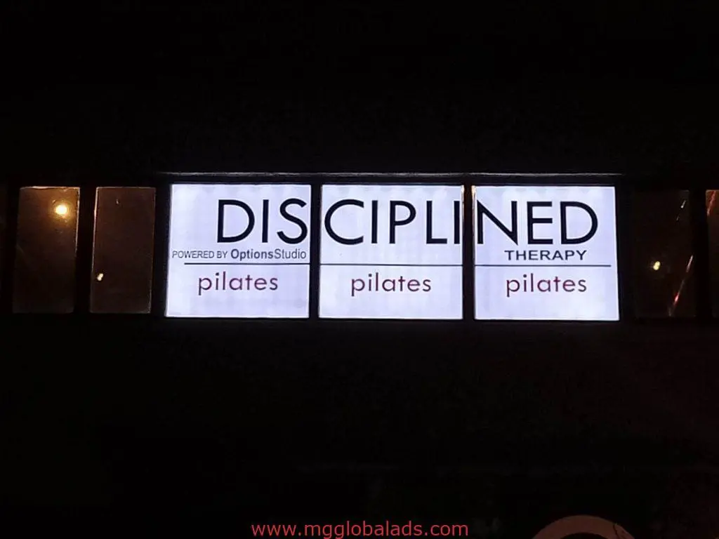 Metallic indoor LED signage for DISCIPLINED THERAPY and OptionsStudio in Mandaluyong by M&G Global Ads.