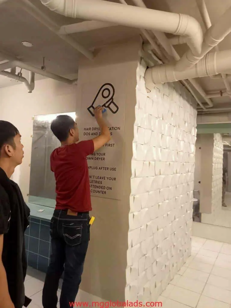 LED restroom signage for hair dryer usage installation in Mandaluyong public washroom, by M&G Global Ads.