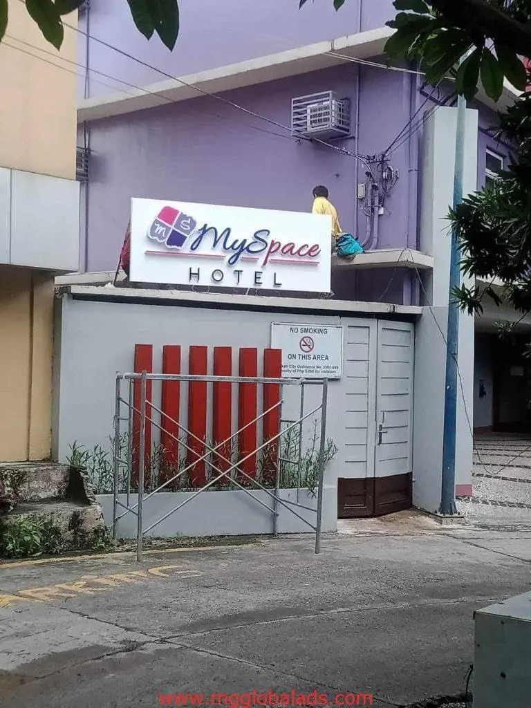 Building signage and No Smoking metallic sign for MySpace Hotel, Makati, with purple exterior by M&G Global Ads.