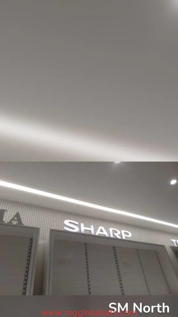 SHARP LED signage display in a well-lit store with modern lighting ceiling, Quezon City location, by M&G Global Ads.