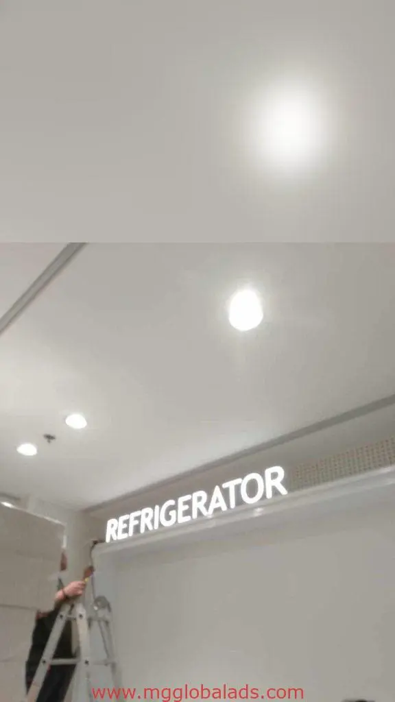 Illuminated acrylic REFRIGERATOR signage installation on indoor ceiling in Makati, bright lights nearby, by M&G Global Ads.