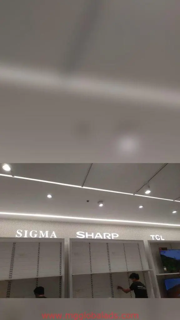 Acrylic signage for SIGMA, SHARP, TCL retail shelves in Makati store, modern ceiling design. By M&G Global Ads.