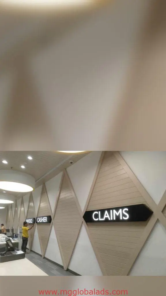 LED office signage INVOICE, CASHIER, CLAIMS at service counter in modern Makati building, diamond wall panels by M&G Global Ads.