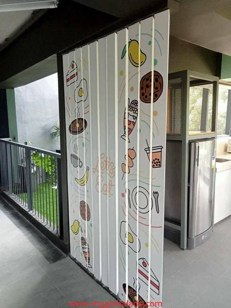 Metallic Let’s Eat signage on a food-themed partition in a Makati restaurant, perfect for indoor-outdoor spaces by M&G Global Ads.