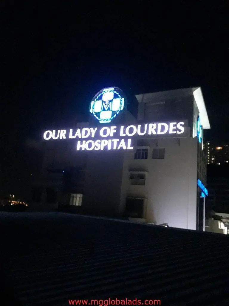 LED signage for Our Lady of Lourdes Hospital on a building in Quezon City at night by M&G Global Ads.