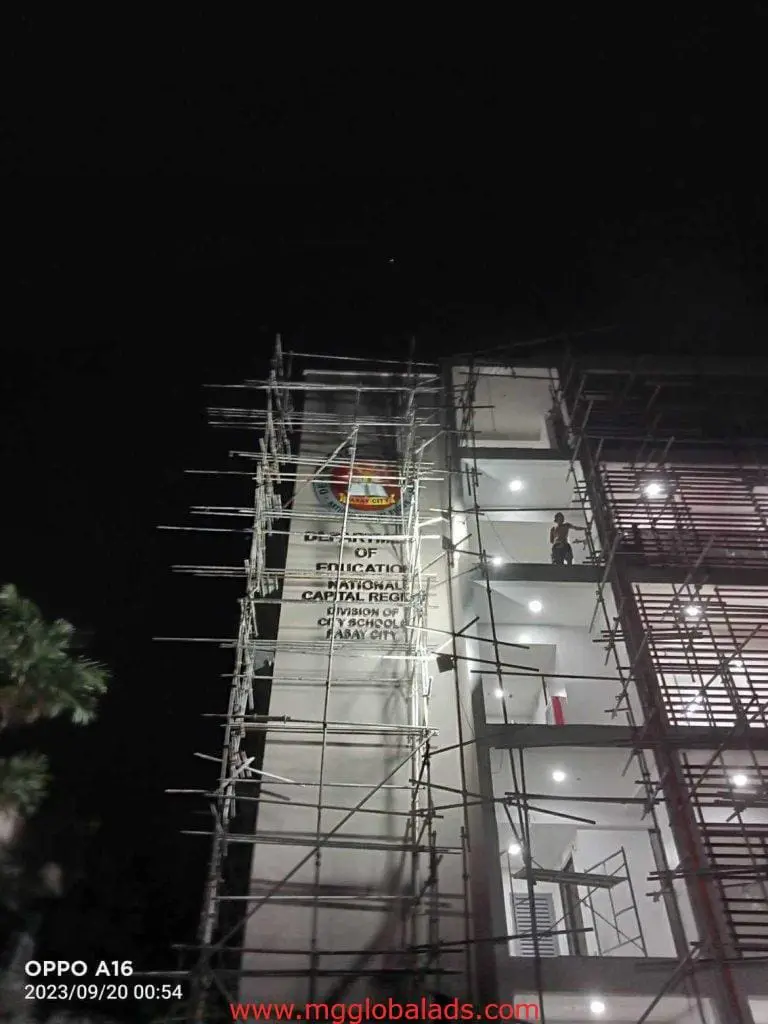 LED signage for Department of Education on a building under construction at night in Ortigas, timestamped 2023/09/20 by M&G Global Ads.
