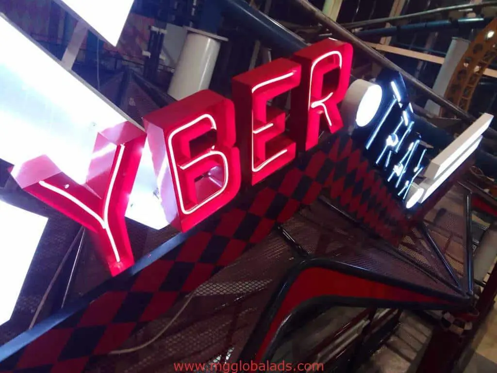 CYBER TRAX illuminated LED neon signage, red and white letters on metallic checkered sign in Quezon City industrial venue by M&G Global Ads.