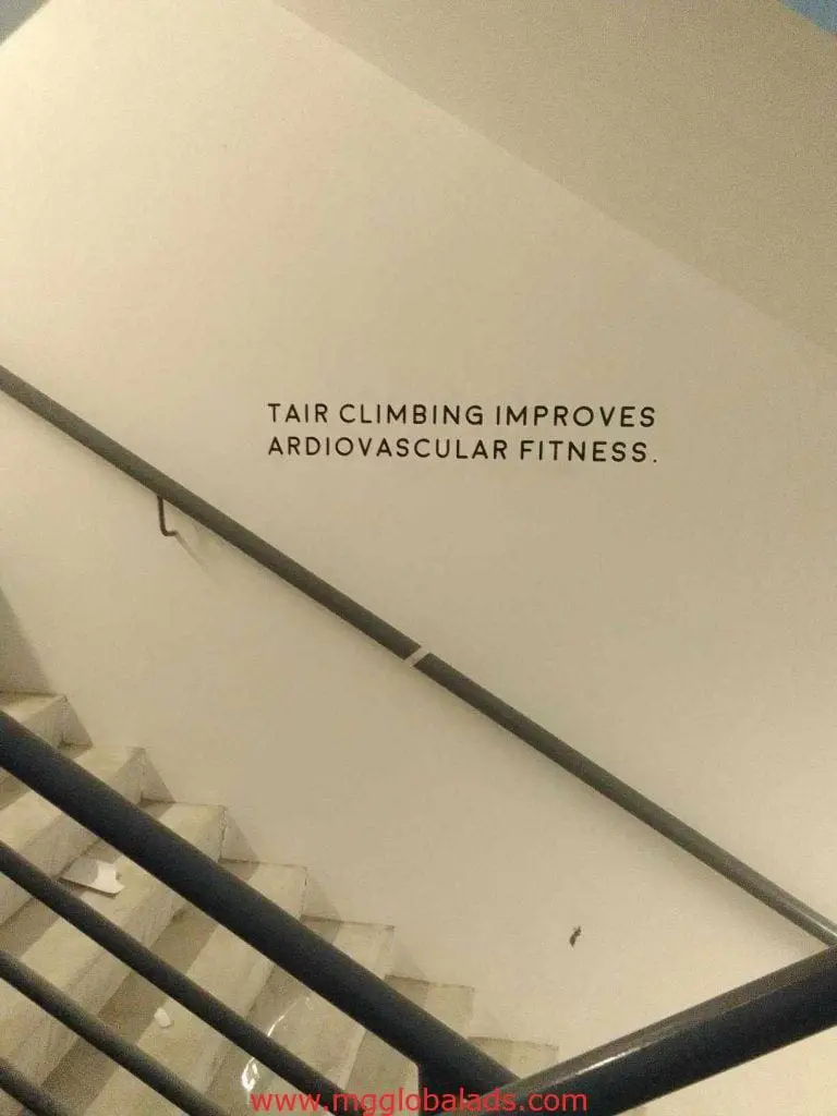 Acrylic signage with motivational quote and typos in a stairwell, Quezon City location, by M&G Global Ads.