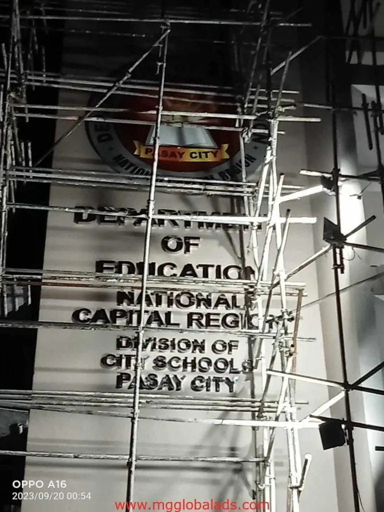Outdoor building signage for Department of Education Pasay City with scaffolding, Ortigas location, by M&G Global Ads.