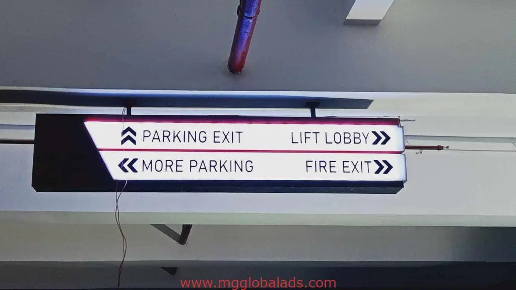 Ceiling-mounted LED parking signage in Ortigas shows Parking Exit, More Parking, Lift Lobby, Fire Exit arrows by M&G Global Ads.