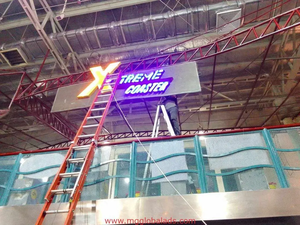 LED neon signage for Xtreme Coaster in neon blue and yellow, installed indoors in Makati by M&G Global Ads.