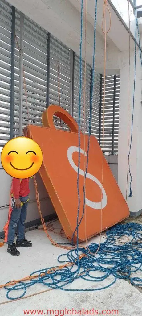 LED signage display with orange padlock prop and child in Quezon City event setup by M&G Global Ads.