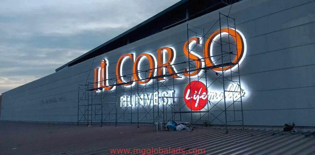 IL CORSO LED signage on a building in Ortigas with scaffolding, at dusk. By M&G Global Ads.