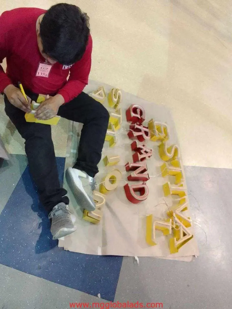 Indoor aLED neon signage installation for FESTIVAL GRAND STATION MOLA in Mandaluyong, yellow/red letters by M&G Global Ads.