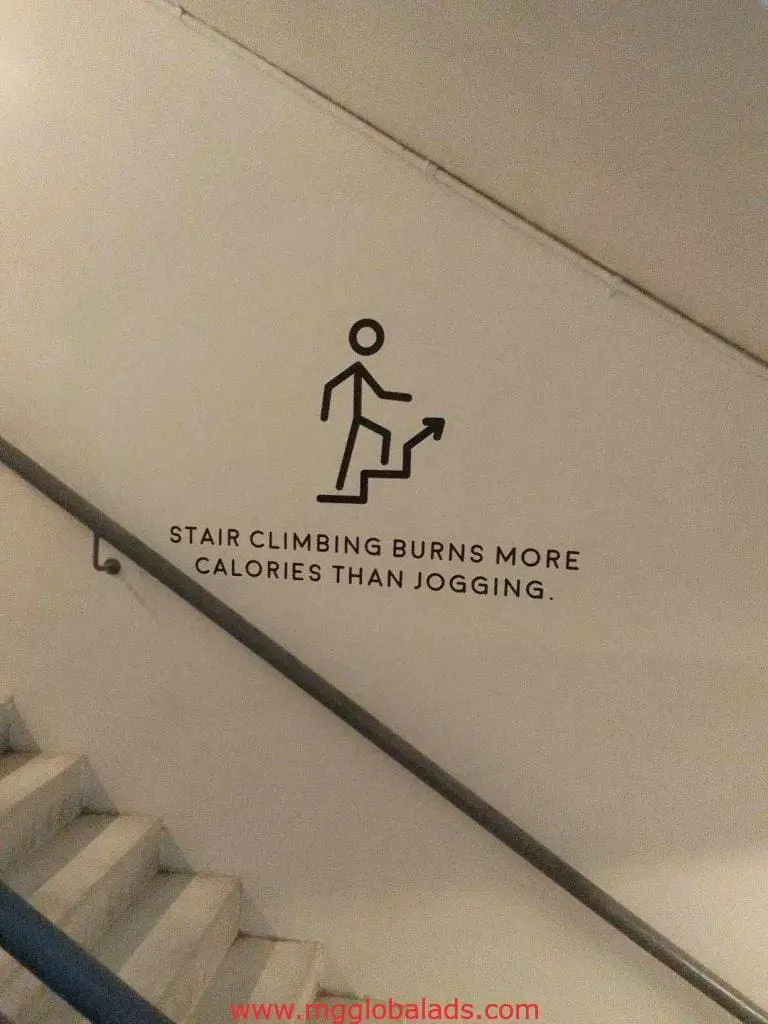 Building motivational staircase signage with stick figure and wellness message in Makati by M&G Global Ads.
