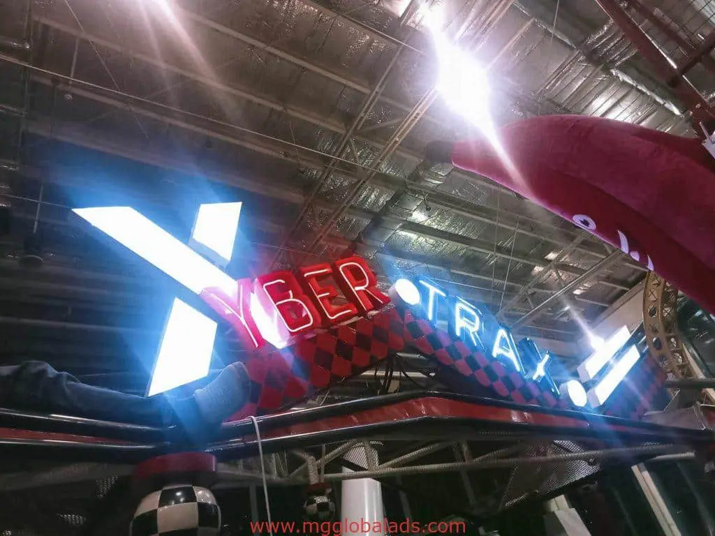 LED neon indoor signage for CYBER TRAX with checkered pattern, metallic ceiling, red shark, in Makati by M&G Global Ads.