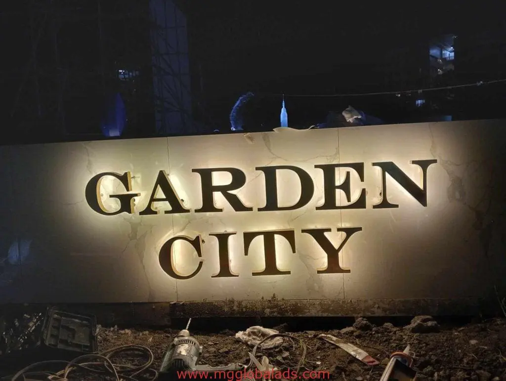 LED outdoor signage for GARDEN CITY in bold letters with tools and dirt seen, Makati installation by M&G Global Ads.