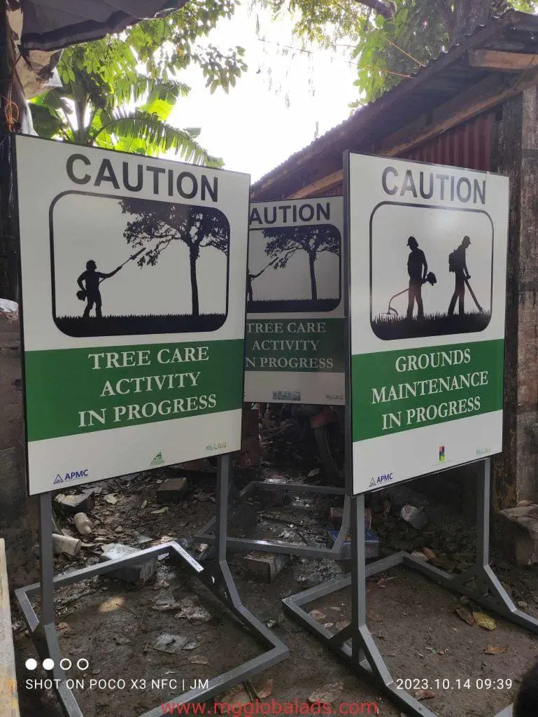 Outdoor maintenance signage boards in Makati: Tree Care Activity and Grounds Maintenance. Near shed. By M&G Global Ads.