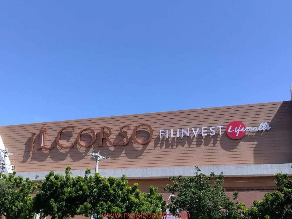 Metallic building signage for IL CORSO Filinvest Lifemalls in BGC, clear blue sky and greenery, by M&G Global Ads.