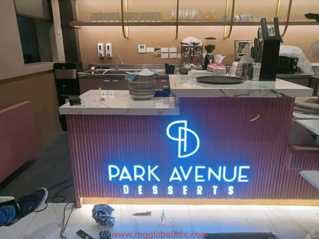 Park Avenue Desserts LED neon signage at a modern dessert shop counter in Makati, ongoing setup visible. By M&G Global Ads.