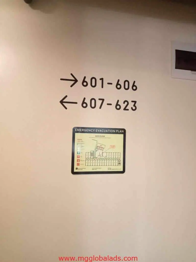 Acrylic directional signage and emergency evacuation plan in Makati, arrows to rooms 601–623, by M&G Global Ads.