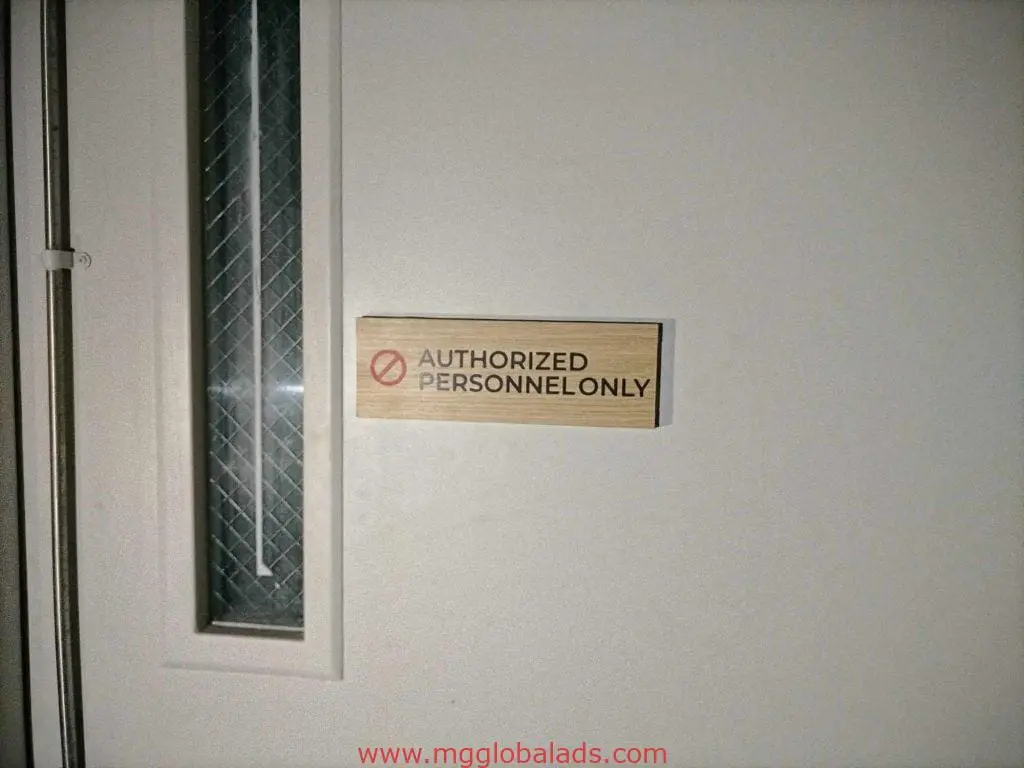 Acrylic door signage for authorized personnel only with red prohibition symbol, Makati location, by M&G Global Ads.