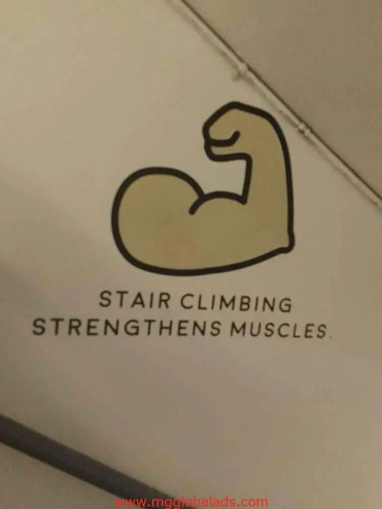 Acrylic signage in Makati with illustration of flexed arm and text Stair climbing strengthens muscles by M&G Global Ads.