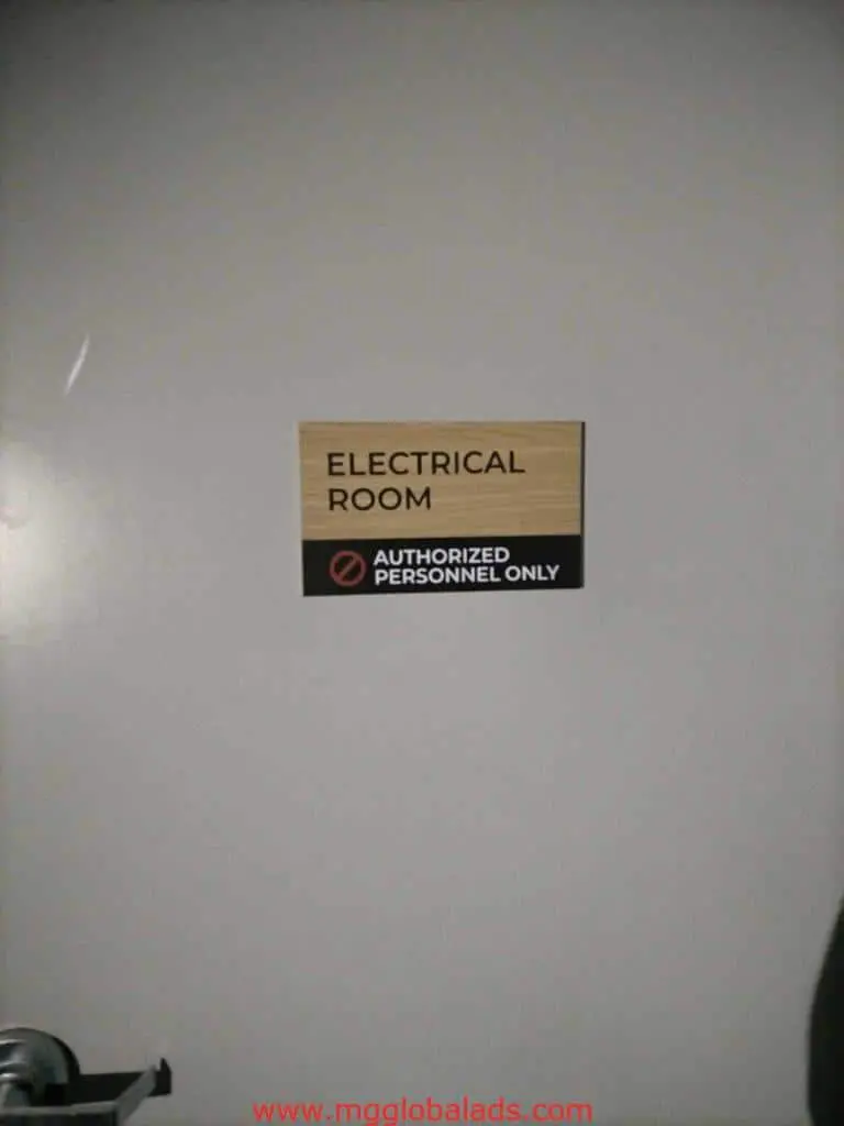 Acrylic electrical room signage with authorized personnel only notice on gray door in Ortigas by M&G Global Ads.