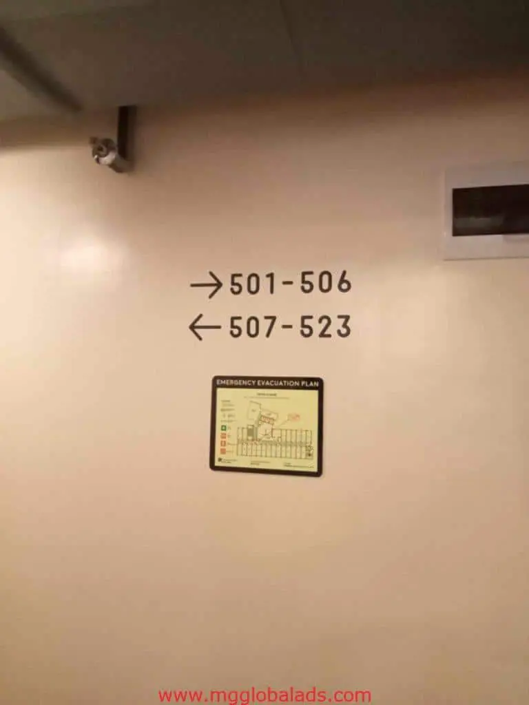 Directional wayfinding sign with emergency plan in Makati hotel corridor, metallic finish, by M&G Global Ads.
