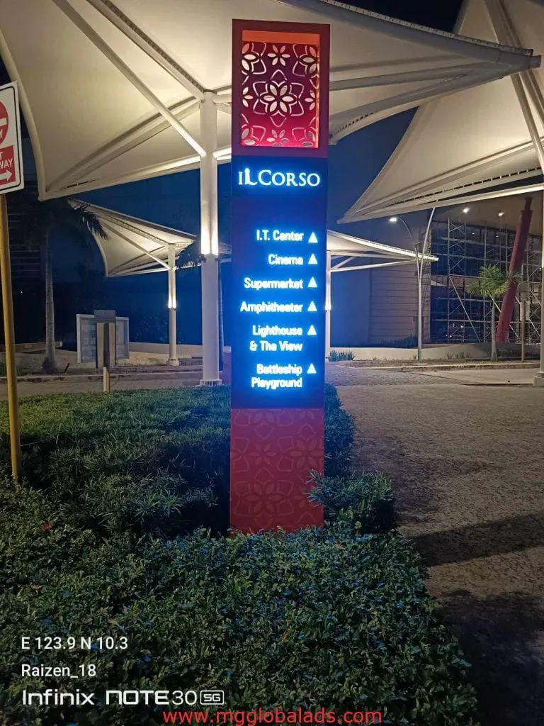 LED pylon signage for IL CORSO with venue directions at night, white canopies behind, Makati location by M&G Global Ads.