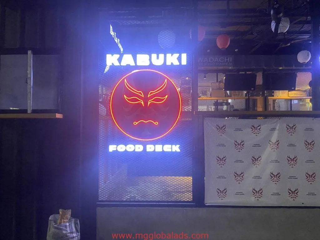 LED neon restaurant window signage for Kabuki Food Deck with red kabuki mask in Makati by M&G Global Ads.