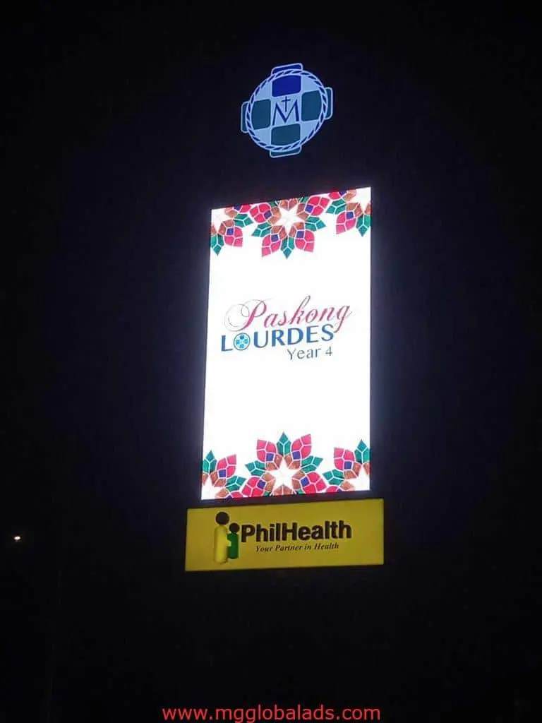 Illuminated digital signage for PhilHealth in Quezon City, Paskong Lourdes Year 4, festive red/green decor by M&G Global Ads.