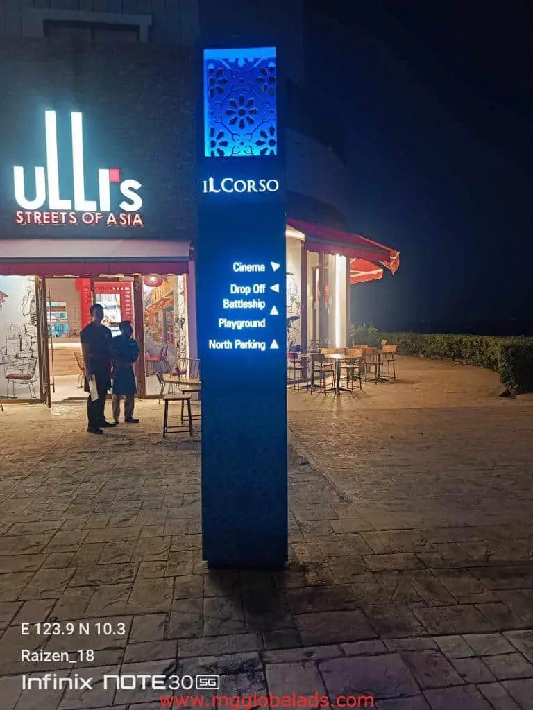 Building wayfinding signage for Il Corso in Makati, lit up at night near uLLi’s Streets of Asia, by M&G Global Ads.